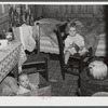 In the second story of a tobacco barn used as living quarters by family of workers from Fort Bragg, North Carolina. Near Fayetteville, North Carolina.