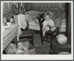 In the second story of a tobacco barn used as living quarters by family of workers from Fort Bragg, North Carolina. Near Fayetteville, North Carolina.