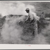 Henry Dukes, Negro FSA (Farm Security Administration) borrower, burning charcoal. Southwestern part of Heard County, Georgia.