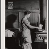 Mrs. Lemuel Smith preparing the afternoon meal on her farm in Carroll County, Georgia (see general caption).