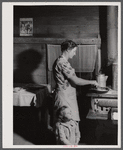 Mrs. Lemuel Smith preparing the afternoon meal on her farm in Carroll County, Georgia (see general caption).