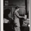 Mrs. Lemuel Smith preparing the afternoon meal on her farm in Carroll County, Georgia (see general caption).