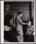 Mrs. Lemuel Smith preparing the afternoon meal on her farm in Carroll County, Georgia (see general caption).