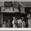 Negro sawmill workers getting some lunch in the back of a grocery store in Franklin. Heard County, Georgia.