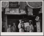 Negro sawmill workers getting some lunch in the back of a grocery store in Franklin. Heard County, Georgia.
