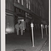 Soldiers from Fort Benning on the main street of Columbus, Georgia, at night.