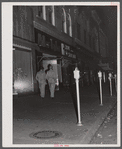 Soldiers from Fort Benning on the main street of Columbus, Georgia, at night.