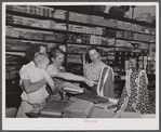 Saturday afternoon shoppers in the Bickers Goodwin store in Greensboro. Greene County, Georgia.