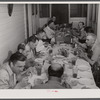 Workers from the powder plant having dinner at their boarding house. Childersburg, Alabama.