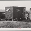 Mrs. David Gurly Tull, her son, and husband came from Arkansas looking for work at the new powder plant near Childersburg. Mr. Tull couldn't get a job at the powder plant but found temporary employment building bunkhouses. Childersburg, Alabama.