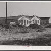 New cafes and bunkhouses amid the laying of a new sewer. Childersburg, Alabama.