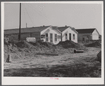 New cafes and bunkhouses amid the laying of a new sewer. Childersburg, Alabama.
