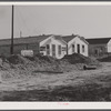 New cafes and bunkhouses amid the laying of a new sewer. Childersburg, Alabama.