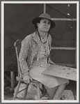 Mrs. David Gurly Tull, her son, and husband came from Arkansas looking for work at the new powder plant near Childersburg. Mr. Tull couldn't get a job at the powder plant but found temporary employment building bunkhouses. Childersburg, Alabama.