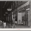 Soldier and his girl coming out of a restaurant in Anniston, Alabama.