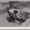 Digging for white clay which some people eat. Near Siloam, Greene County, Georgia.