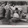Inspecting newly-arrived chicks for the FSA (Farm Security Administration) Food for Defense program at the depot in Greensboro. Greene County, Georgia.