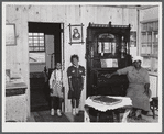 This family had to move out of the area being taken over by the Army for maneuver grounds. They now live in one of the prefabricated houses that were built by FSA (Farm Security Administration). Milford, Caroline County, Virginia.