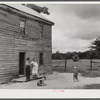 Mr. and Mrs. Russell Tombs watching the last load of their belongings go off. They are moving out of the area being taken over by the Army for maneuver grounds. Caroline County, Virginia.