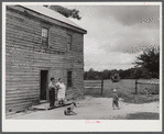 Mr. and Mrs. Russell Tombs watching the last load of their belongings go off. They are moving out of the area being taken over by the Army for maneuver grounds. Caroline County, Virginia.