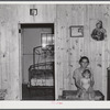 This woman and her family moved from the Army maneuver ground area to a prefabricated house built by FSA (Farm Security Administration) to take care of some of these families. Milford, Caroline County, Virginia.