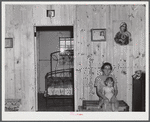 This woman and her family moved from the Army maneuver ground area to a prefabricated house built by FSA (Farm Security Administration) to take care of some of these families. Milford, Caroline County, Virginia.