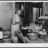 This woman is packing her belongings and getting ready to move out of the area taken over by the Army in Caroline County, Virginia.