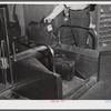 The baggage, after being weighed at the ticket counter, goes down a chute to the baggage department. Municipal airport, Washington, D.C..