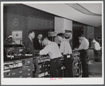 From behind one of the ticket counters in the waiting room. Washington, D.C. municipal airport.