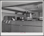 In the teletype room where weather data and other information is constantly being received. Washington D.C. municipal airport.