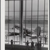 An airliner on the field seen through the window of the waiting room. Municipal airport, Washington, D.C..