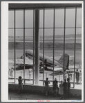 An airliner on the field seen through the window of the waiting room. Municipal airport, Washington, D.C..