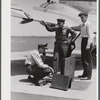 Using the field phone which connects with the administration building. Washington D.C. municipal airport.