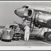 An airliner taking on baggage and fuel. Washington, D.C. municipal airport.