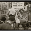Child on protest float holding sign reading "Workers Demand Free Rent for the Unemployed!"