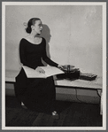 Martha Graham teaching with sheet music and a record player