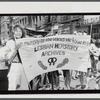 Lesbian Herstory Archives marchers with banner