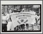 Lesbian Herstory Archives marchers with banner