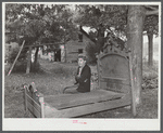 Mr. M.B. Kiechle watching his grandson moving out of the area being taken over by Pine Camp expansion. Mr. Kiechle's own farm is just outside the boundary line of the area. Near Pine Camp, New York.