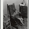 One of the children of Mr. and Mrs. Nelson Tousant. The Tousants are moving out of the Pine Camp expansion area after having lived there for seventeen years. Near Pine Camp, New York.