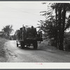 One of the many trucks to be seen carrying a farmer's belongings out of the Pine Camp expansion area. Near Pine Camp, New York.