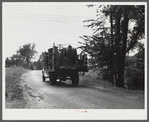 One of the many trucks to be seen carrying a farmer's belongings out of the Pine Camp expansion area. Near Pine Camp, New York.