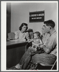 Mr. and Mrs. Carleton Allen and their daughter in the office of the New York Defense Relocation Corps discuss plans for their moving out of the area being taken over by Pine Camp. Watertown, New York.