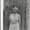 Mrs. Carrie Ward has lived near Leraysville for seventeen years. Now she is planning to move out of the Army camp area to a small farm in Sandy Creek. Her barn is numbered for auctioning. Leraysville, New York.