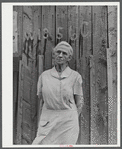 Mrs. Carrie Ward has lived near Leraysville for seventeen years. Now she is planning to move out of the Army camp area to a small farm in Sandy Creek. Her barn is numbered for auctioning. Leraysville, New York.
