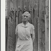 Mrs. Carrie Ward has lived near Leraysville for seventeen years. Now she is planning to move out of the Army camp area to a small farm in Sandy Creek. Her barn is numbered for auctioning. Leraysville, New York.