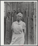 Mrs. Carrie Ward has lived near Leraysville for seventeen years. Now she is planning to move out of the Army camp area to a small farm in Sandy Creek. Her barn is numbered for auctioning. Leraysville, New York.