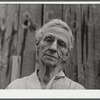 Mrs. Carrie Ward has lived near Leraysville for seventeen years. Now she is planning to move out of the Army camp area to a small farm in Sandy Creek. Her barn is numbered for auctioning. Leraysville, New York.