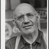 Mr. Merton Hoover, postmaster, sixty-three years old, who loses his position through the wiping out of the town of Sterlingville, New York, in the Pine Camp expansion area. He is moving to West Carthage, New York.