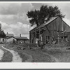 The farm of Dan Sampson, father of eleven children, in the Pine Camp expansion area. The family will be moved from this unproductive farm to one aquired by the New York Defense Relocation Corps in South Rutland, New York.